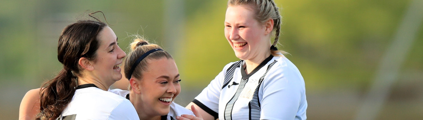 BHASVIC Womens Football players celebrating a County Cup Final winning goal