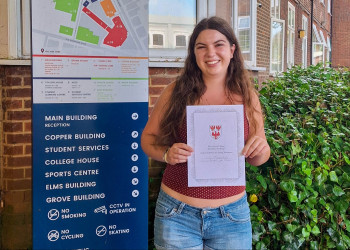 Lily Stands at BHASVIC with her commendation certificate from The Queen's College