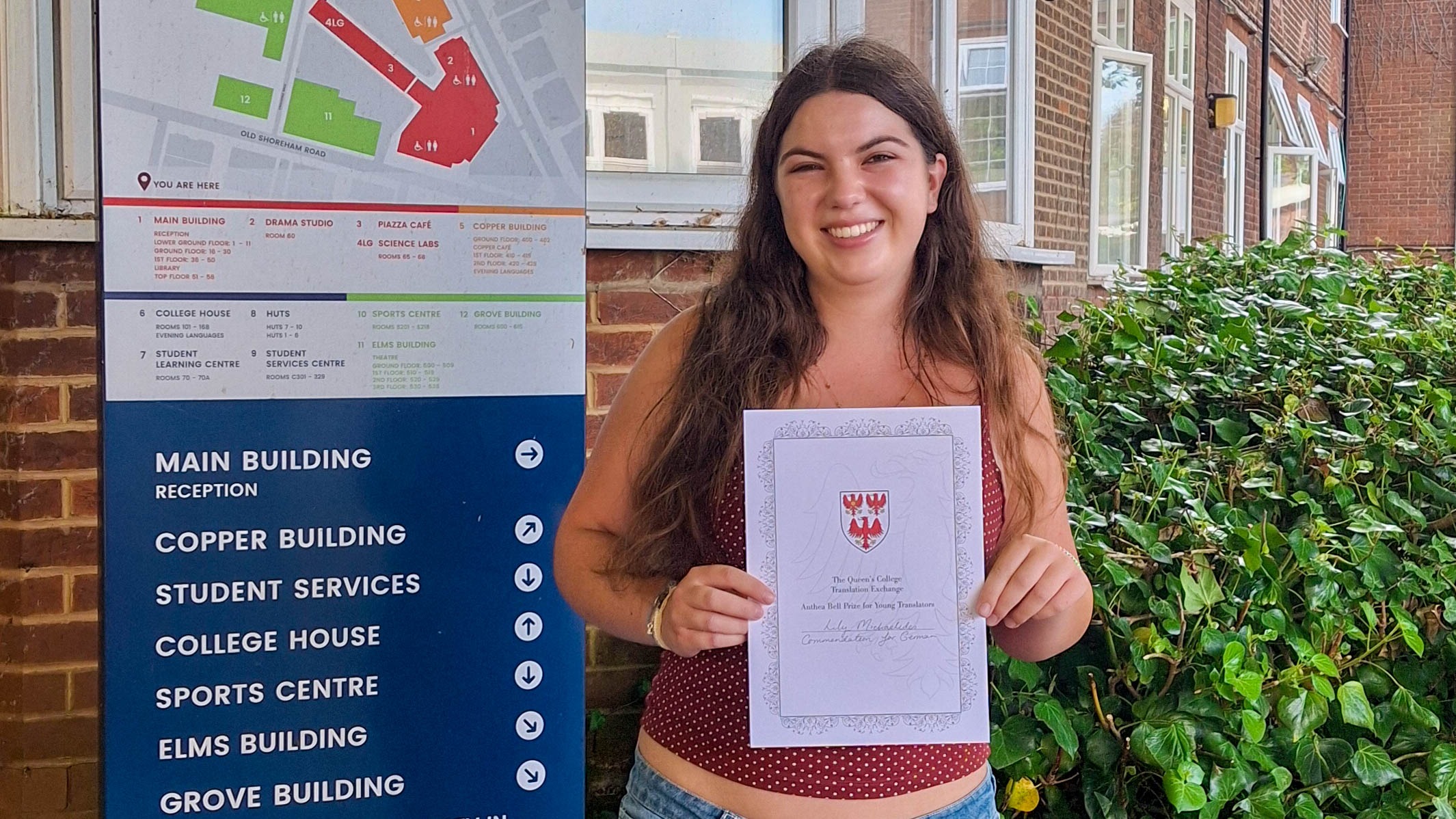 Lily Stands at BHASVIC with her commendation certificate from The Queen's College