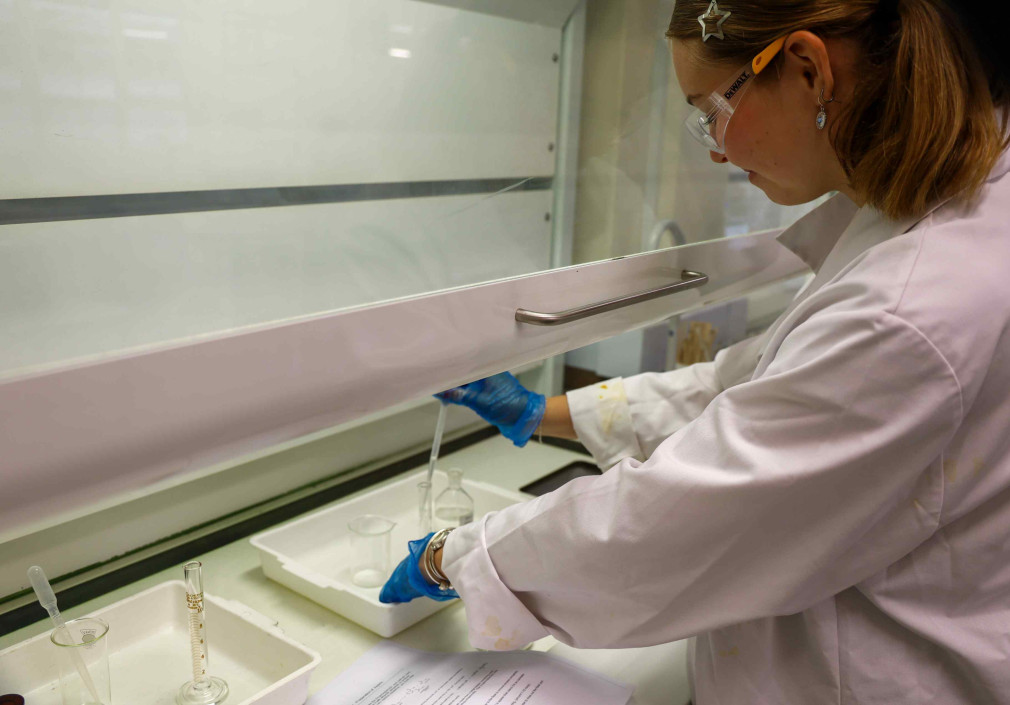 Hannah adds the ethanoic anhydride in the fume hood.
