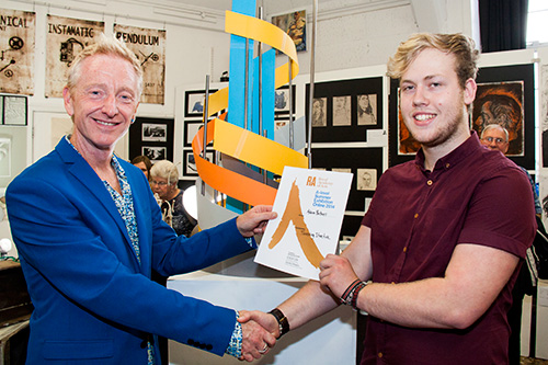 Paul Penketh, Head of Visual Arts at BHASVIC presenting the Royal Academy of Arts certificate to Adam Britnell 
