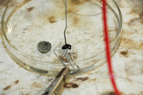 A closeup of the fractals shows the leaf-like shapes they form. The grey and black material is where the silver becomes silver oxide instead.