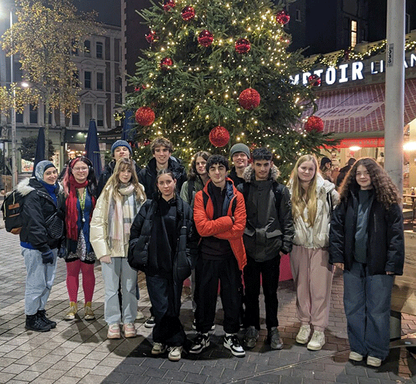 BHASVIC students standing next to Christmas tree after winning the London heat of UK Space Design Comp