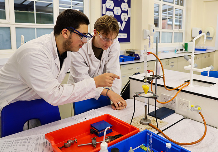 George and Hector discuss whether it’s refluxed for long enough before re-arranging the apparatus for distillation.