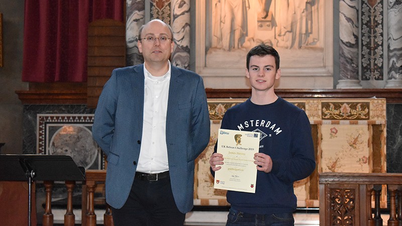 Photo: James receiving his finalist's certificate from Eljakim Schrijvers, from the international Bebras organisation.