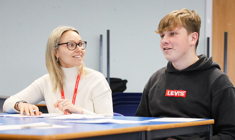  Business students benefitting from interview practice 