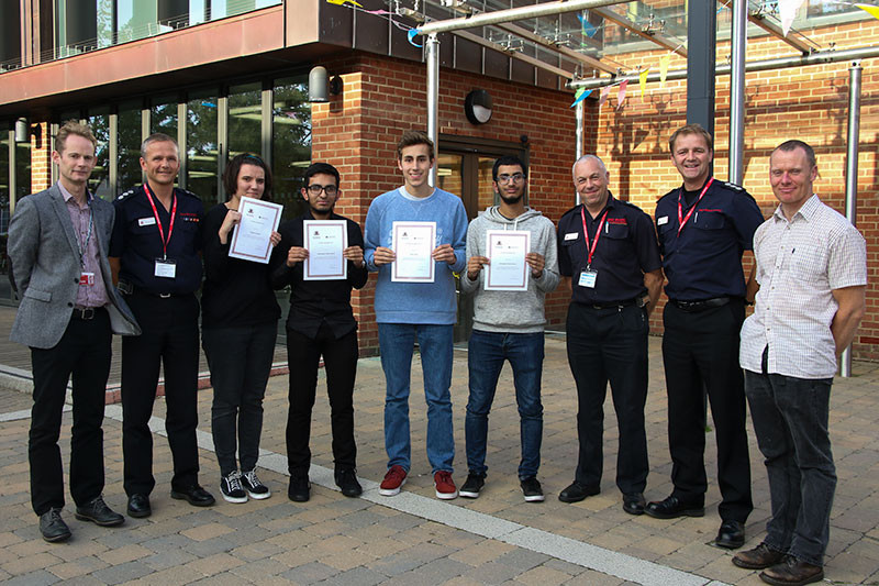Researchers receiving their certificates
