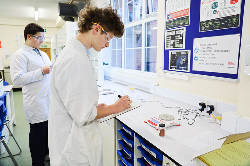 George and Finn measure out their reagents and record the masses