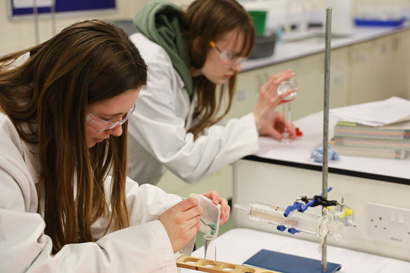 Isobel prepares the solid CuCO3 whilst Lucy gets the acid ready