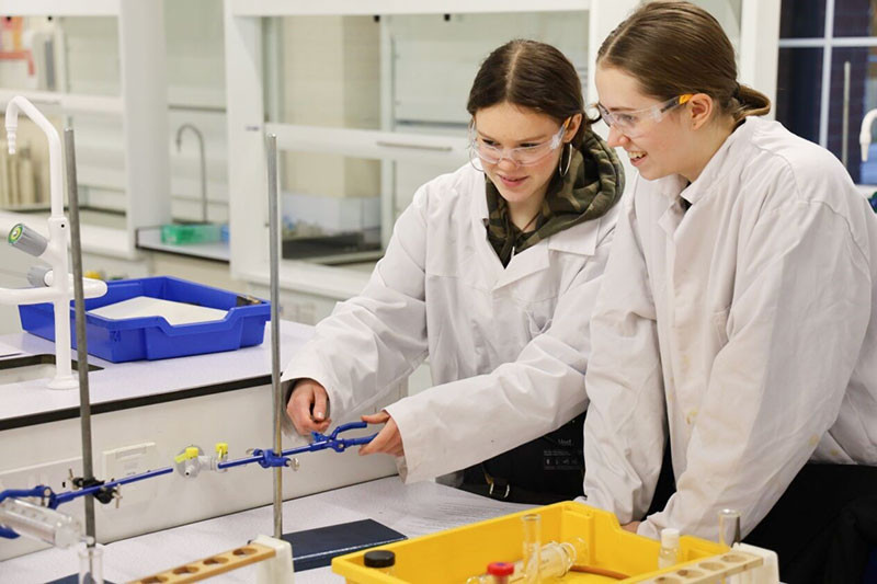 Lauren and Millie check the height they’ll clamp the gas syringe at so it’s stable